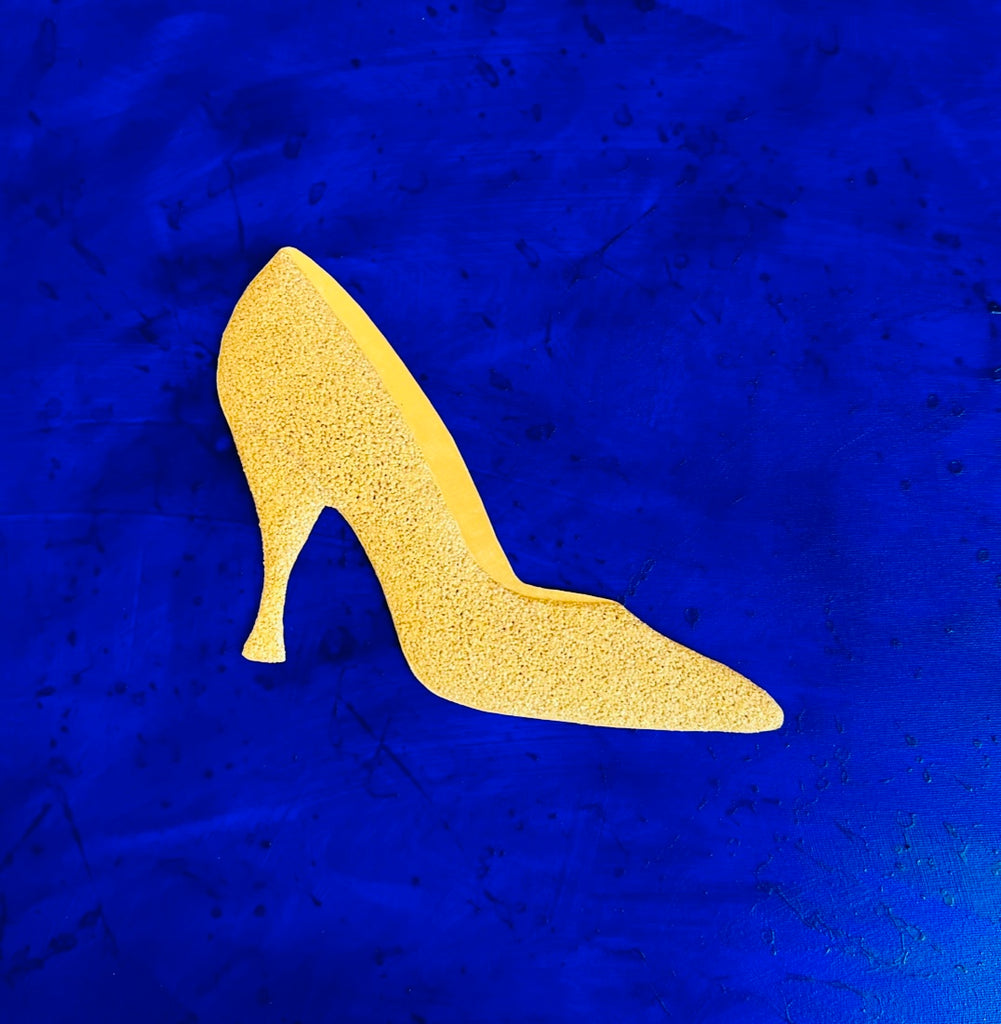 GOLDEN SHOE ON BLUE